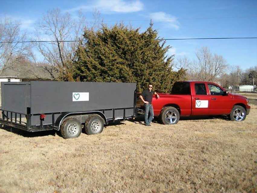 Where it all started Travis standing in front of his first truck and trailer