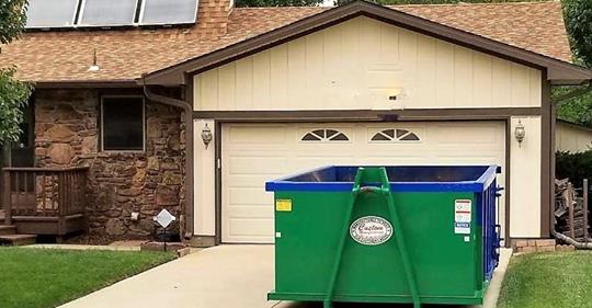 15 Yard roll off dumpster rental delivered onto a driveway